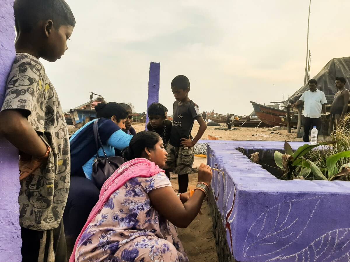 Women from the coastal fishing village of Penthakotta in Odisha beautify the blue-green water filtration system and work to improve the public area around the project 