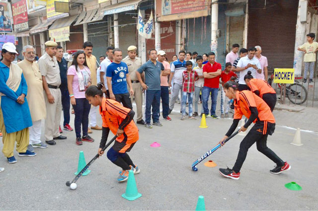 To promote gender equality, women and girls participated in different sporting events, including hockey. Photo by Deputy Commissioners Office, Jhajjar, India To promote gender equality, women and girls participated in different sporting events, including hockey. Photo by Deputy Commissioners Office, Jhajjar, India