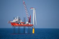 An offshore wind turbine under construction in the North Sea. Photo by DJ Mattaar/Shutterstock. 