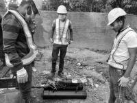 Fluid Robotics employees with robot during deployment