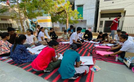 Young people celebrate Environment Day at a park with a poster-making activity. Photo by WRI India.