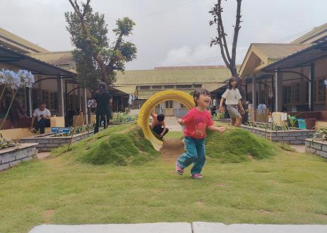 A kid playing in a park