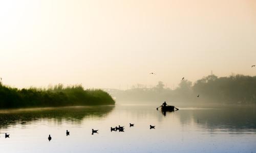 The Yamuna River meandering through the city of Delhi. Photo by Memories Over Mocha/Shutterstock.